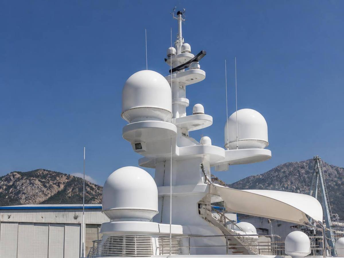 Superyacht mast and navigation dome against the sky
